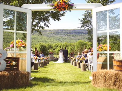 sunny outdoor wedding with view of NY mountains