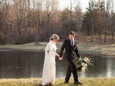 couple walking along lake area